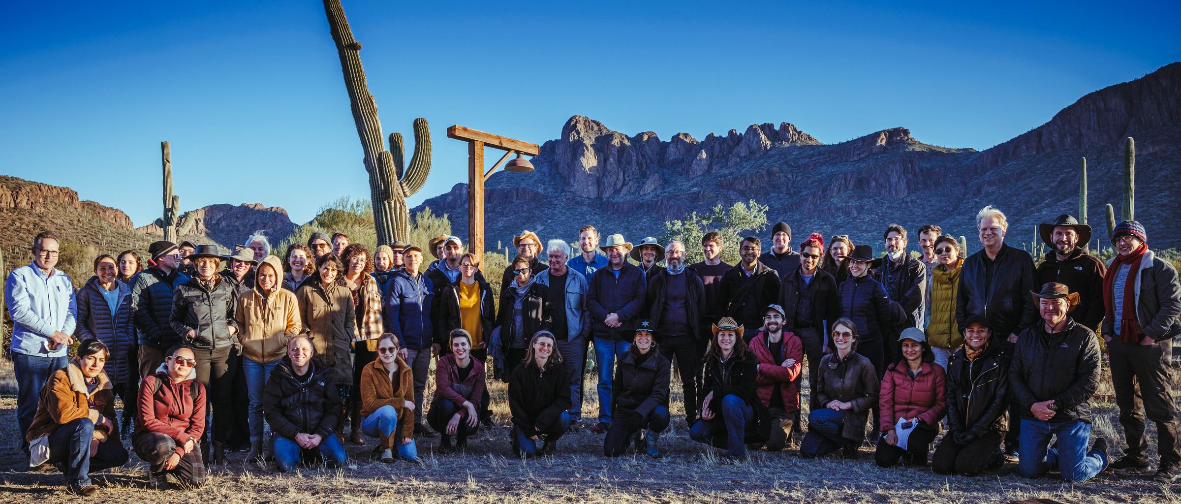 The workshop assembled in front of the Tucson Mountains at White Stallion Ranch